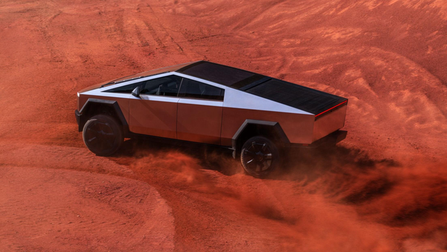 Tesla Cybertruck deslizándose en la parte trasera 3/4 vista de tierra